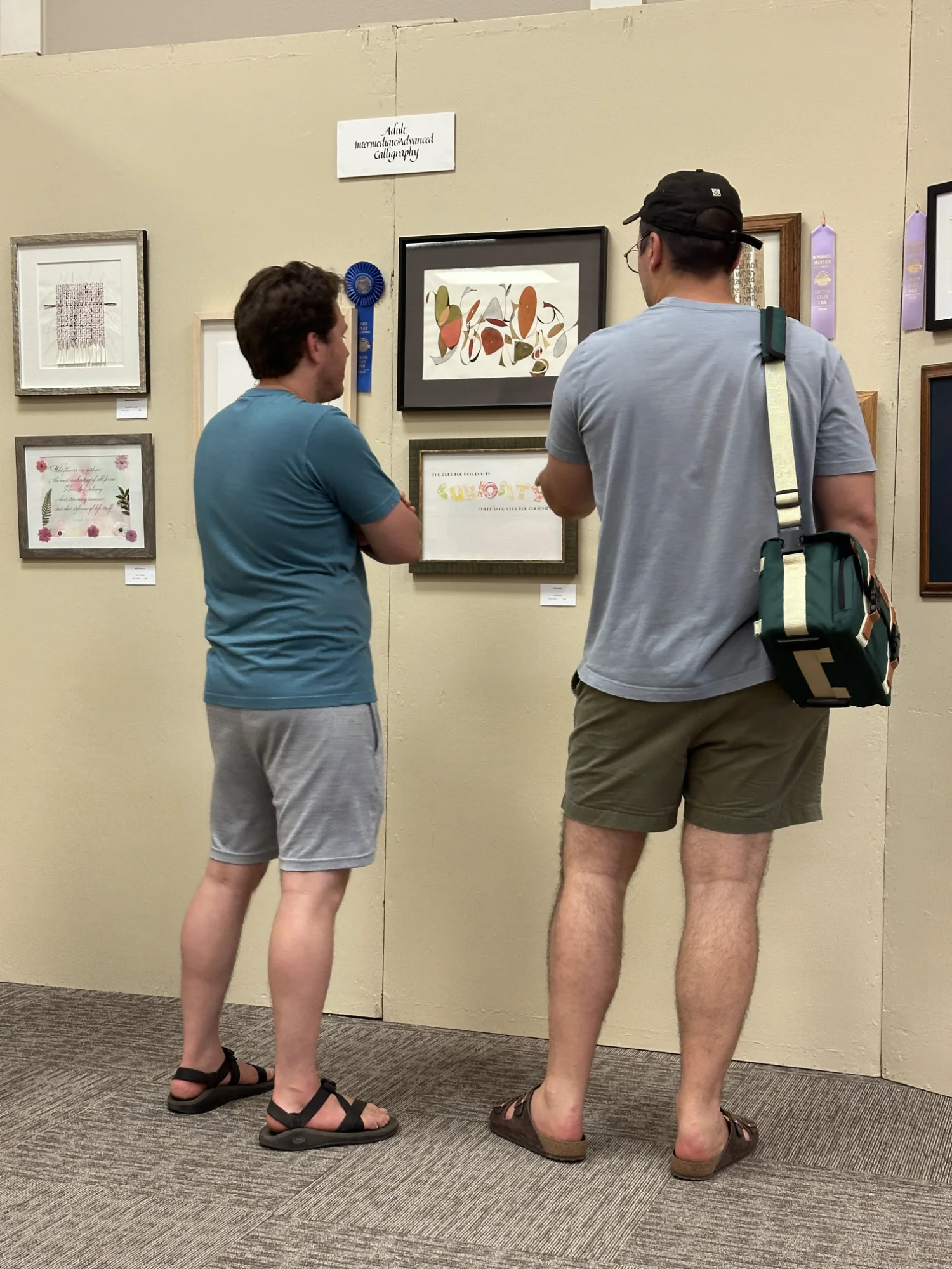 David and Sean observing the exhibit